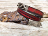 Red bracelet with black wash and silver clasp