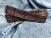 Brown leather belt with handmade cuts in the shape and texture of a crocodile