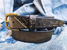 A black and gold hammered leather belt with touch of gold embossed with computer card design by ishaor the perfect elegant gift belt for her