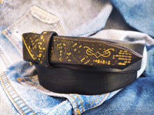 A black hammered leather belt with touch of gold embossed with computer card unique design by ishaor the perfect christmas gift with name on