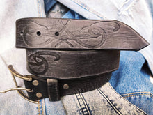 A black leather belt decorated with ishaor tribal unique handmade leather belt by ishaor ,perfect gift for men that love unique products