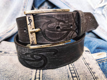 A black leather belt decorated with ishaor tribal unique handmade leather belt by ishaor ,perfect gift for men that love unique products