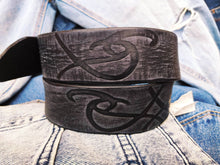 A black leather belt decorated with ishaor tribal unique handmade leather belt by ishaor ,perfect gift for men that love unique products