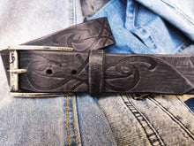 A black leather belt decorated with ishaor tribal unique handmade leather belt by ishaor ,perfect gift for men that love unique products