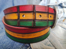 Leather belt designed in African colors, red, yellow and green with a brown wash and belt tail with a crocodile texture