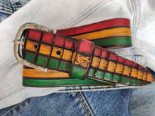 Leather belt designed in African colors, red, yellow and green with a brown wash and belt tail with a crocodile texture