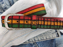 Leather belt designed in African colors, red, yellow and green with a brown wash and belt tail with a crocodile texture