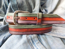 A colorful and summery belt made from three layers of pastel colors orange turquoise and purple  fits with jeans and refreshes any outfit