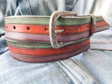 A colorful and summery belt made from three layers of pastel colors orange turquoise and purple  fits with jeans and refreshes any outfit