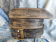 A black leather belt with brown spots that makes it look vintage simple black belt for jeans perfect for daily use and personalized option