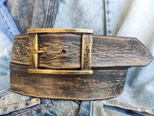 A black leather belt with brown spots that makes it look vintage simple black belt for jeans perfect for daily use and personalized option