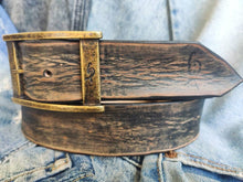 A black leather belt with brown spots that makes it look vintage simple black belt for jeans perfect for daily use and personalized option