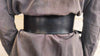 Black leather waist belt with asymmetrical design and bronze Ring. Black dress corset for women, wide leather belt