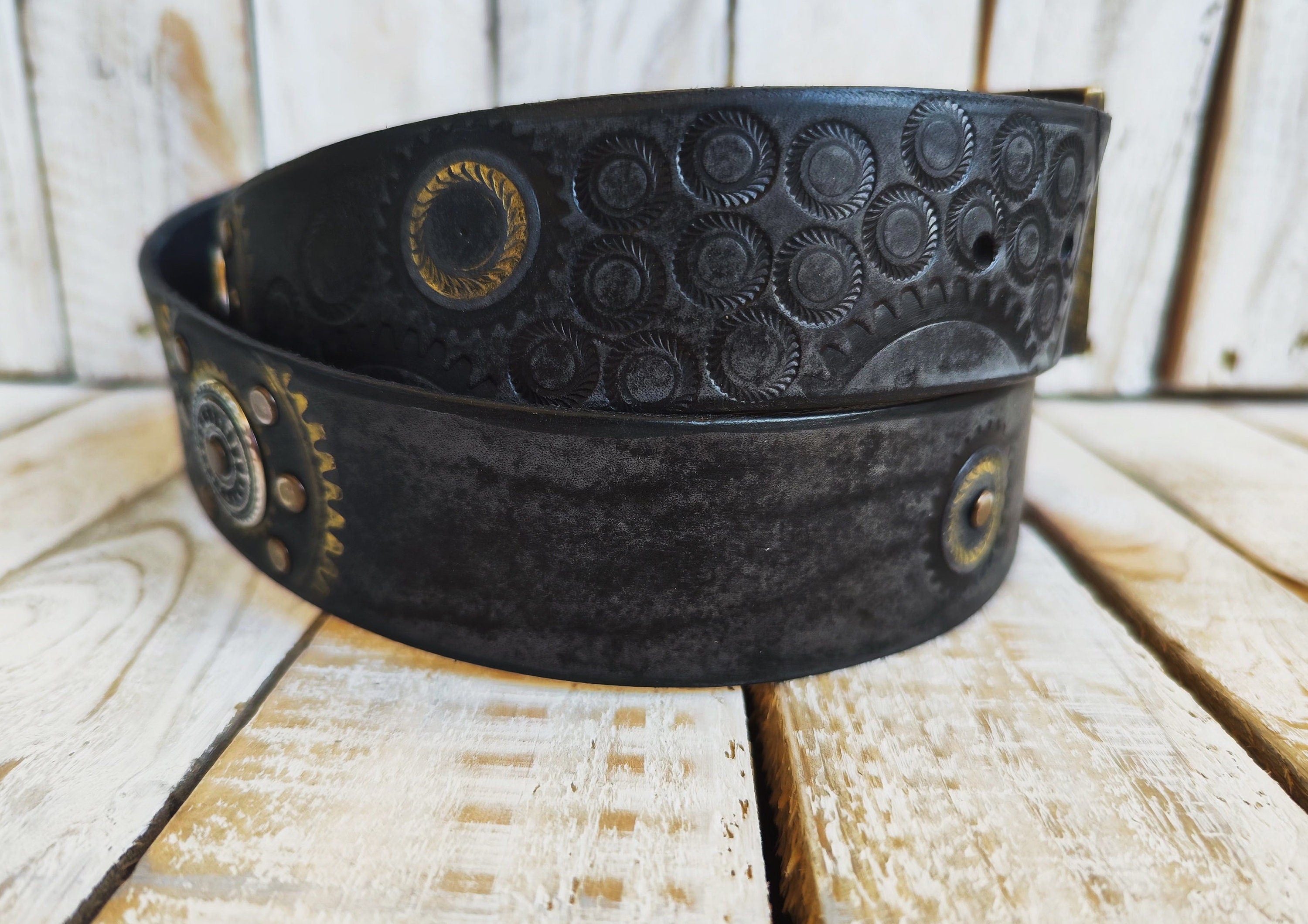 Handcrafted Black Leather Belt with Motorcycle Gear Stamps, Silver Studs, and touch of gold with silver rings and matching buckle.