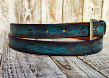 Distressed Turquoise Narrow Leather Belt for men and women with a silver buckle.A Statement Piece for Your Jeans Stunning rough finish.